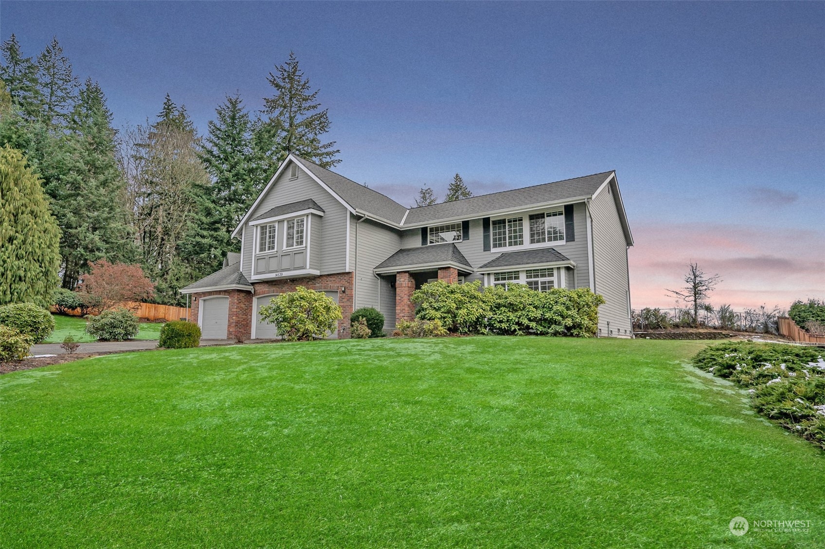 14539 144th Place Southeast Renton, WA 98059 - Photo 1 of 37 a front view of a house with a garden