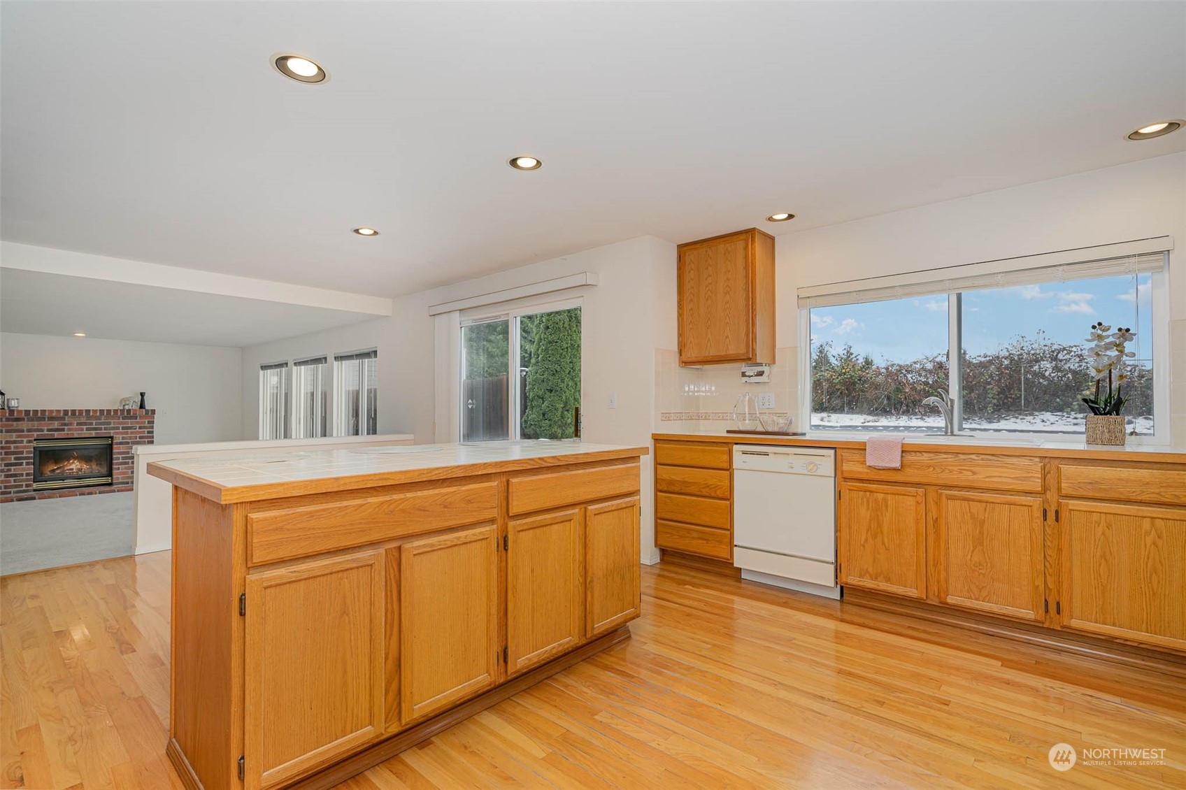 14539 144th Place Southeast Renton, WA 98059 - Photo 14 of 37 a kitchen with stainless steel appliances granite countertop a stove a sink and a refrigerator