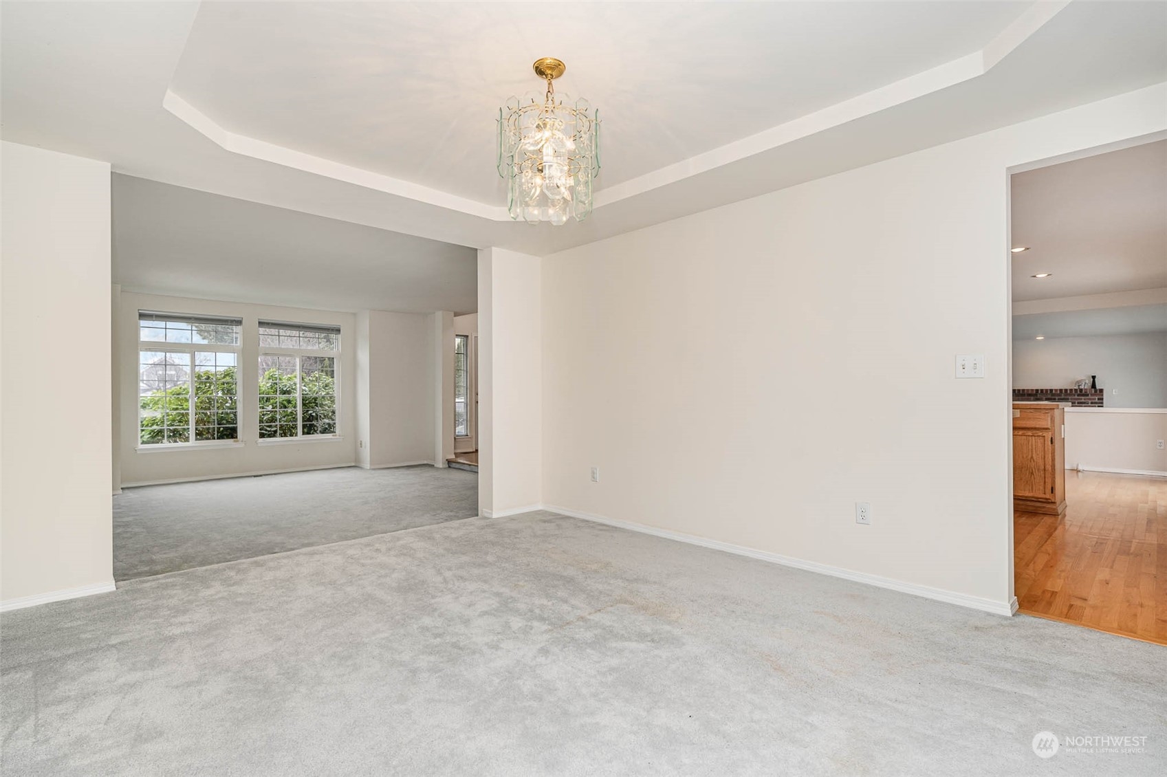 14539 144th Place Southeast Renton, WA 98059 - Photo 18 of 37 a view of a big room with windows and chandelier