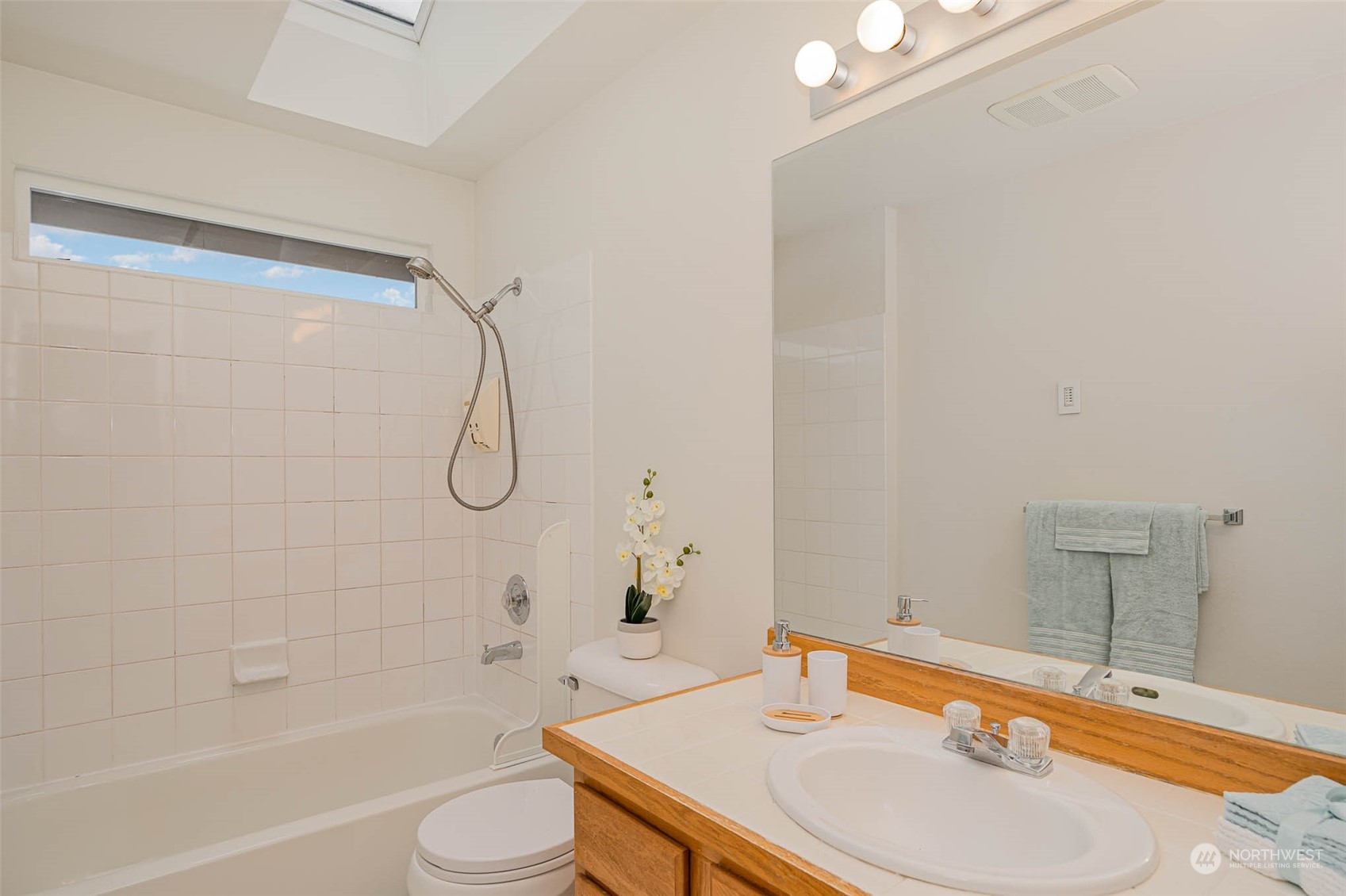 14539 144th Place Southeast Renton, WA 98059 - Photo 23 of 37 a bathroom with a sink toilet and shower