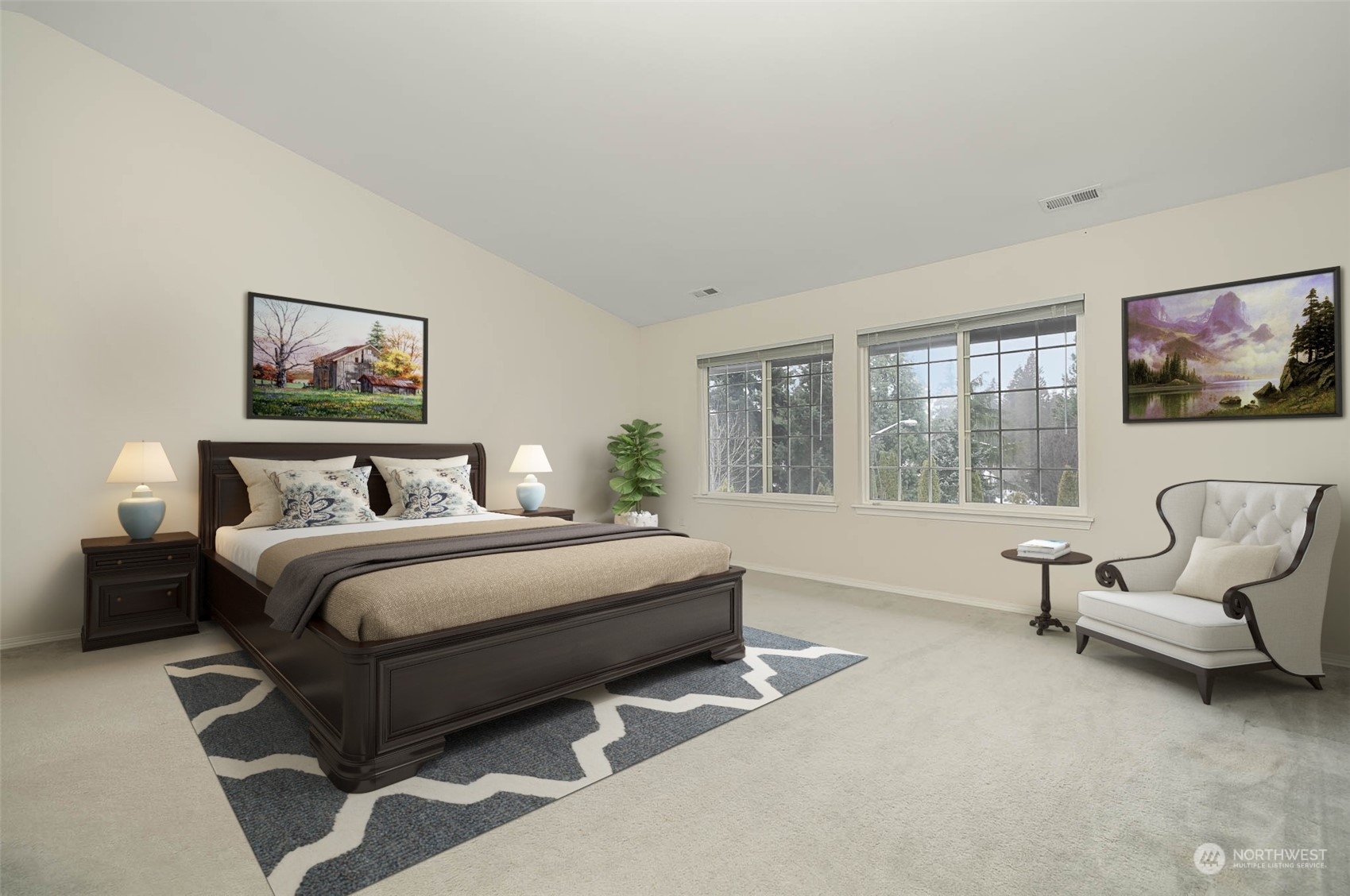14539 144th Place Southeast Renton, WA 98059 - Photo 28 of 37 a spacious bedroom with a bed and a couch
