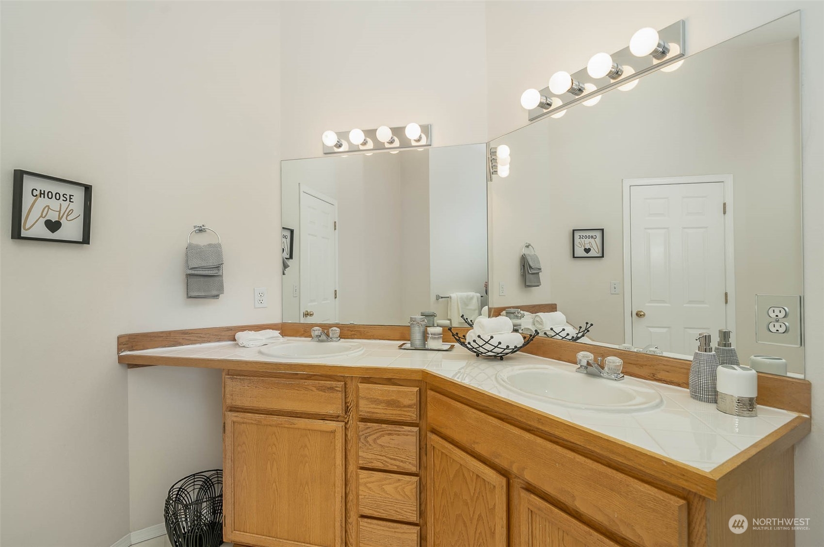 14539 144th Place Southeast Renton, WA 98059 - Photo 32 of 37 a bathroom with a sink double vanity and a mirror