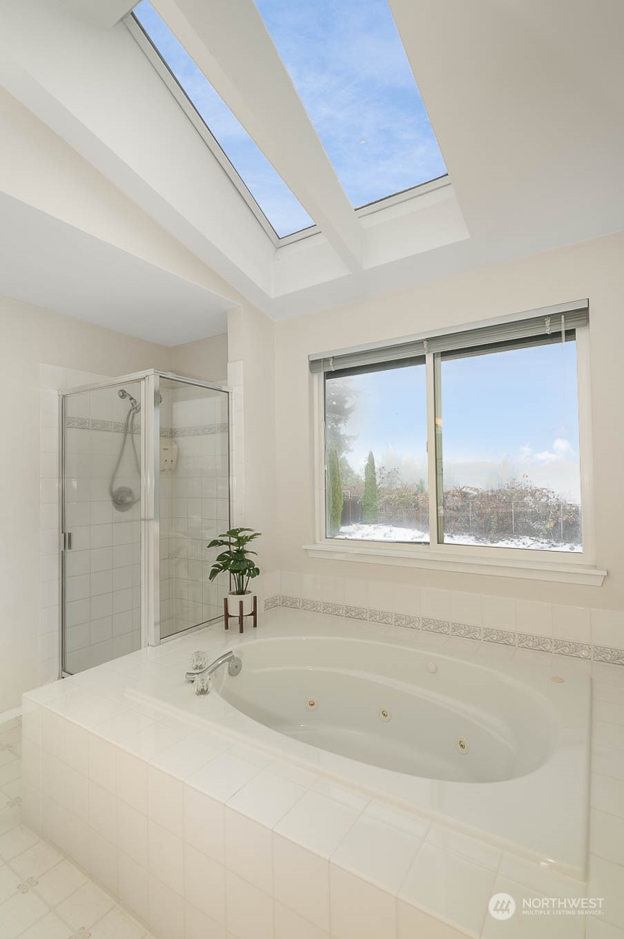 14539 144th Place Southeast Renton, WA 98059 - Photo 33 of 37 a bathroom with a bathtub and windows