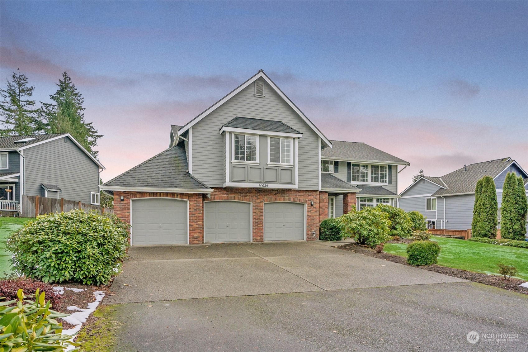 14539 144th Place Southeast Renton, WA 98059 - Photo 4 of 37 a front view of a house with a yard and garage