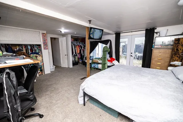 a bed room with a bed and furniture