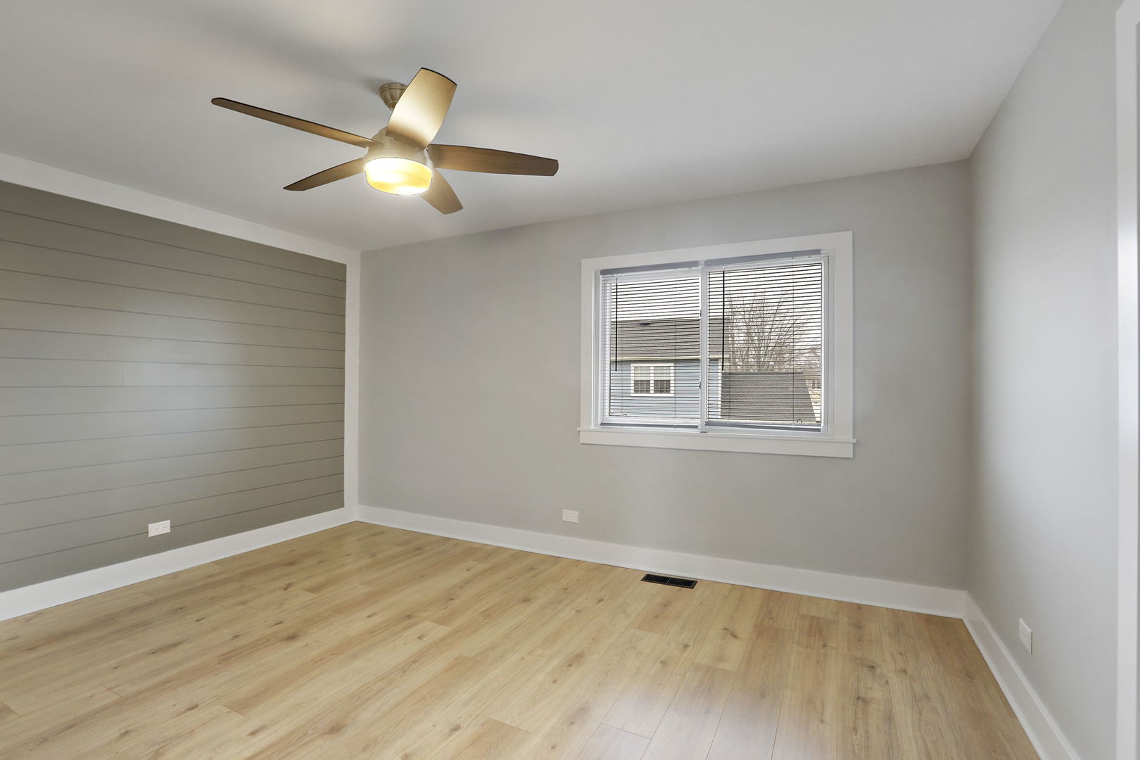 4506 Harbor Circle Hoffman Estates, IL 60192 - Photo 13 of 28 a view of an empty room with window and wooden floor