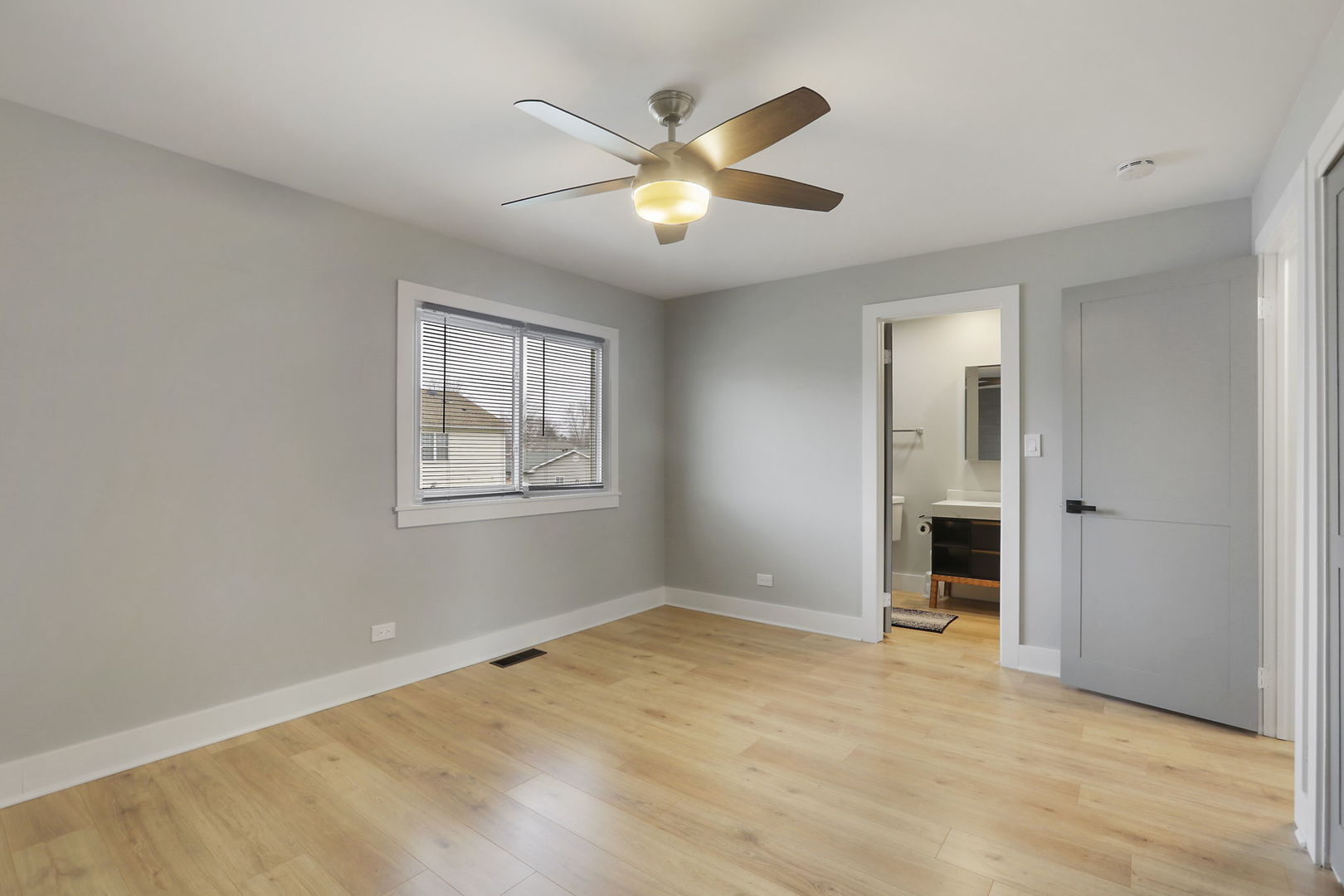 4506 Harbor Circle Hoffman Estates, IL 60192 - Photo 15 of 28 a view of an empty room with window and cabinet