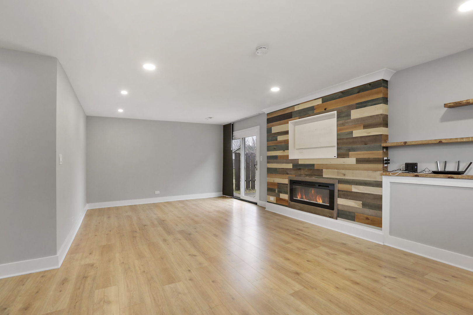 4506 Harbor Circle Hoffman Estates, IL 60192 - Photo 20 of 28 a view of empty room with kitchen appliances and wooden floor