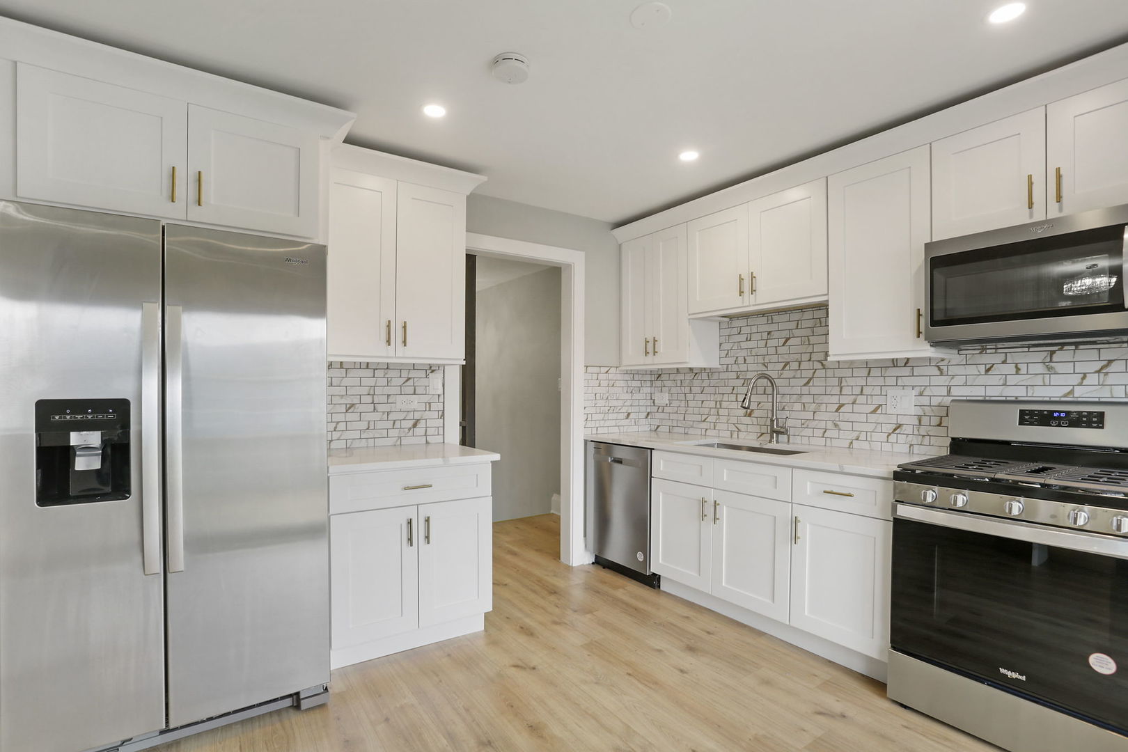 4506 Harbor Circle Hoffman Estates, IL 60192 - Photo 2 of 28 a kitchen with cabinets stainless steel appliances and a counter space