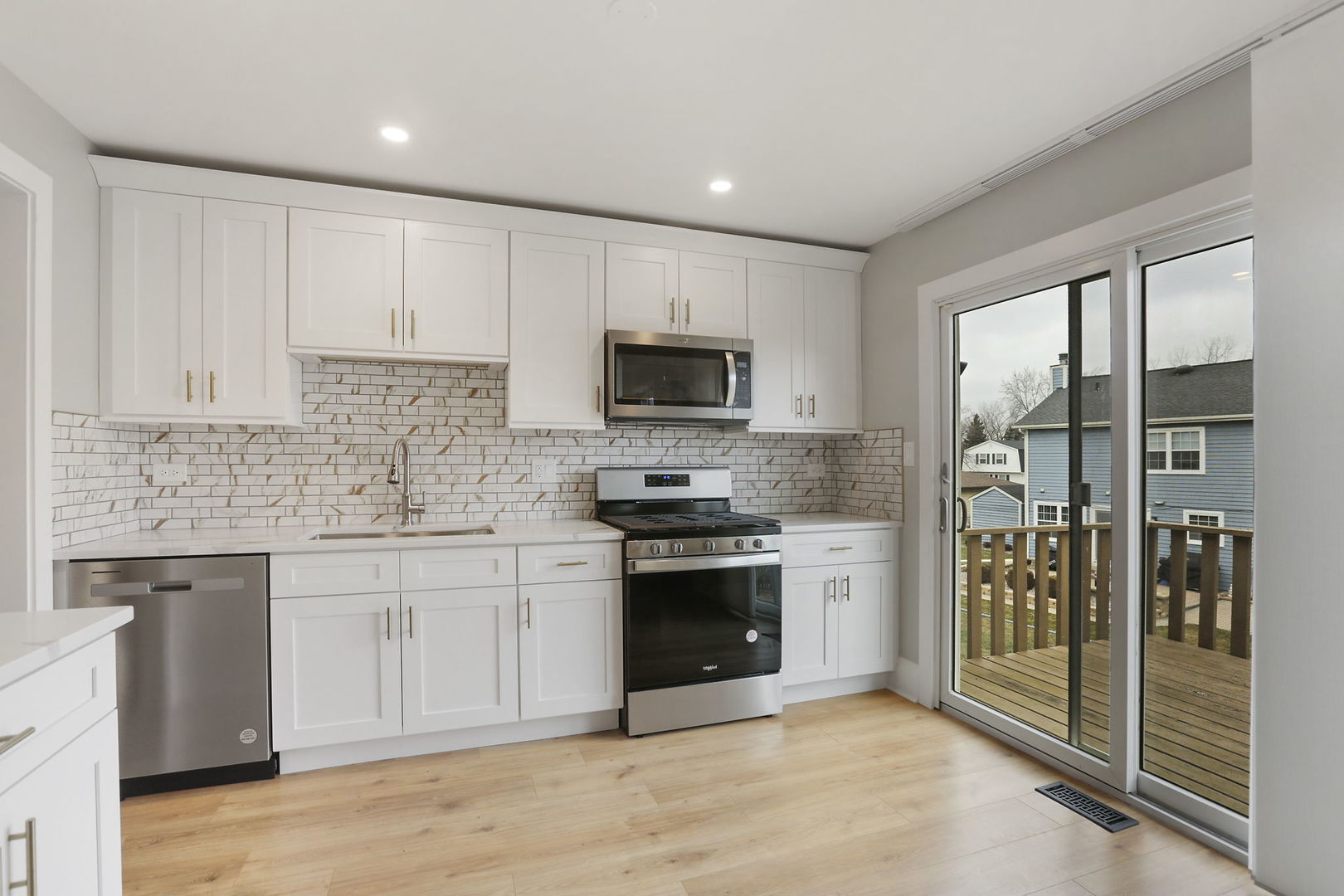 4506 Harbor Circle Hoffman Estates, IL 60192 - Photo 3 of 28 a kitchen with stainless steel appliances granite countertop a stove top oven a sink and a granite counter tops