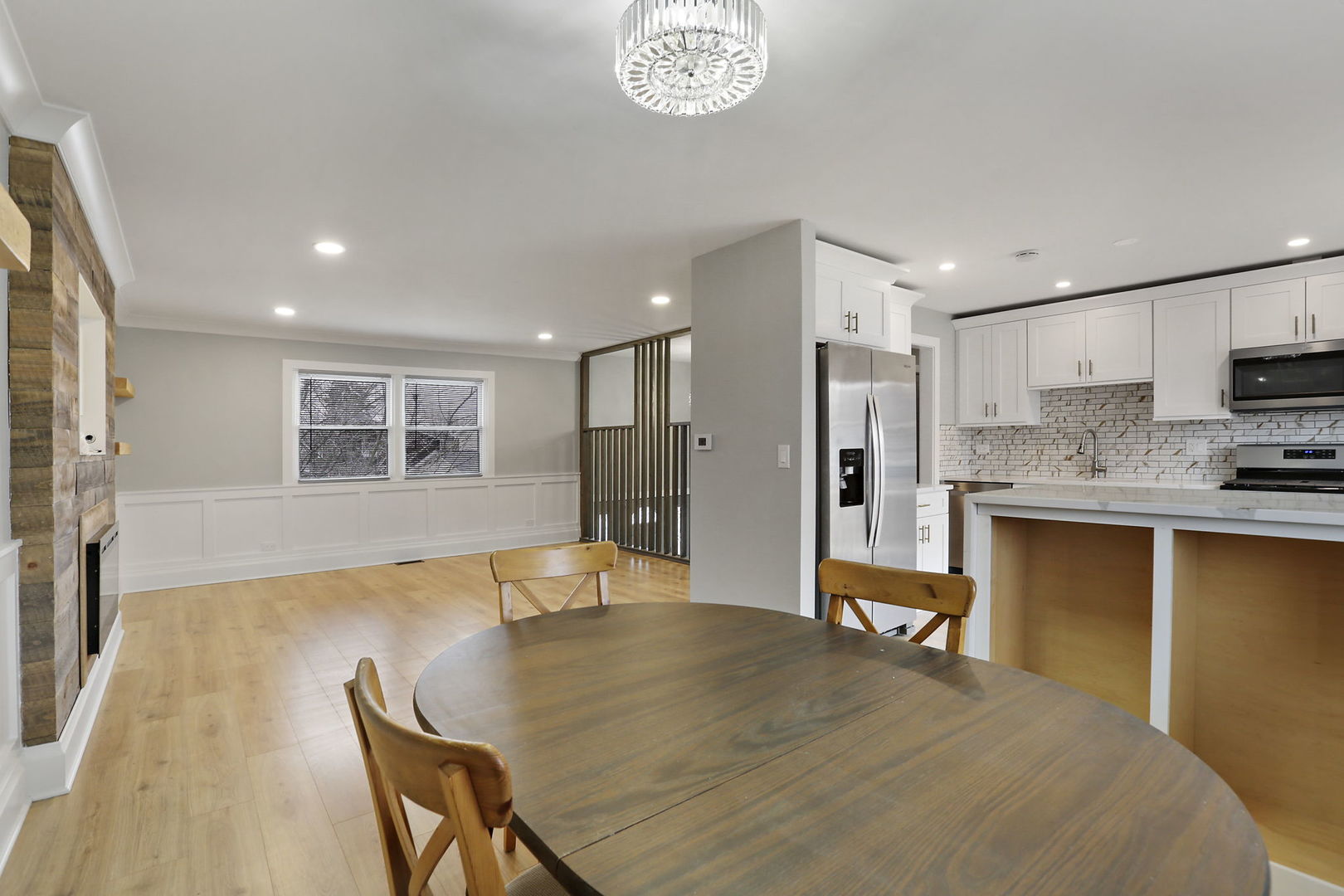 4506 Harbor Circle Hoffman Estates, IL 60192 - Photo 10 of 28 a large kitchen with stainless steel appliances granite countertop a sink and a refrigerator