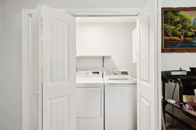 a bathroom with a sink vanity granite and a toilet