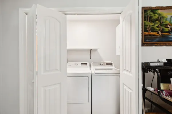 a bathroom with a sink vanity granite and a toilet