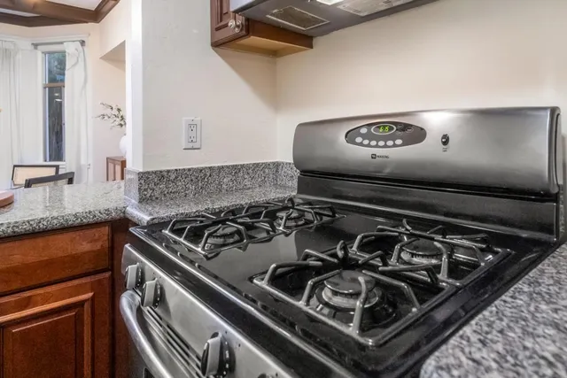 a close up of a stove sitting inside of a kitchen