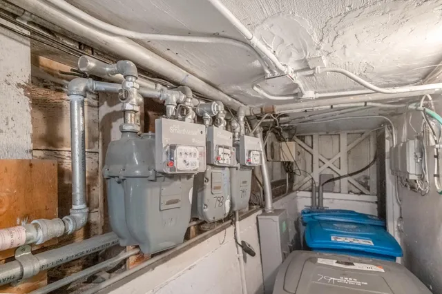 a utility room with lots of wooden furniture