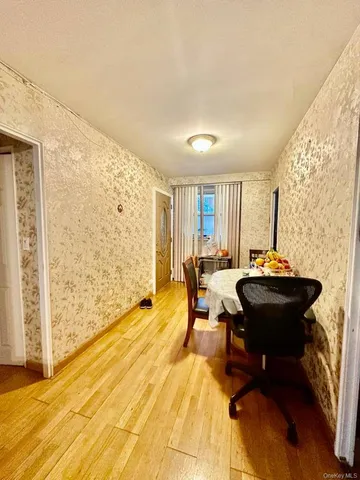 a living room with a table and a chair