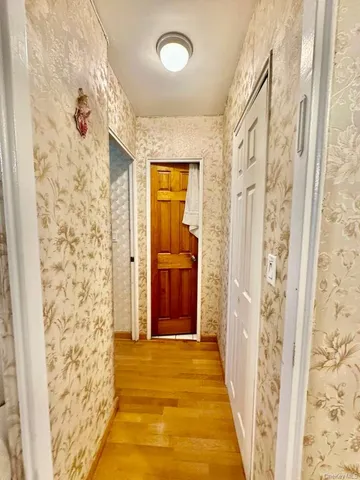 view of a bathroom with shower and a window