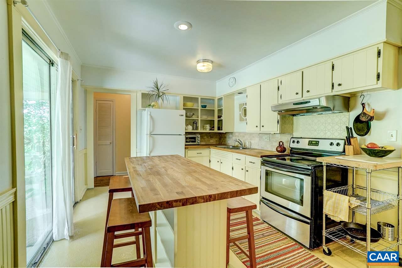 2262 Hamilton Road Louisa, VA 23093 - Photo 2 of 49 a kitchen with a stove a refrigerator and a stove top oven