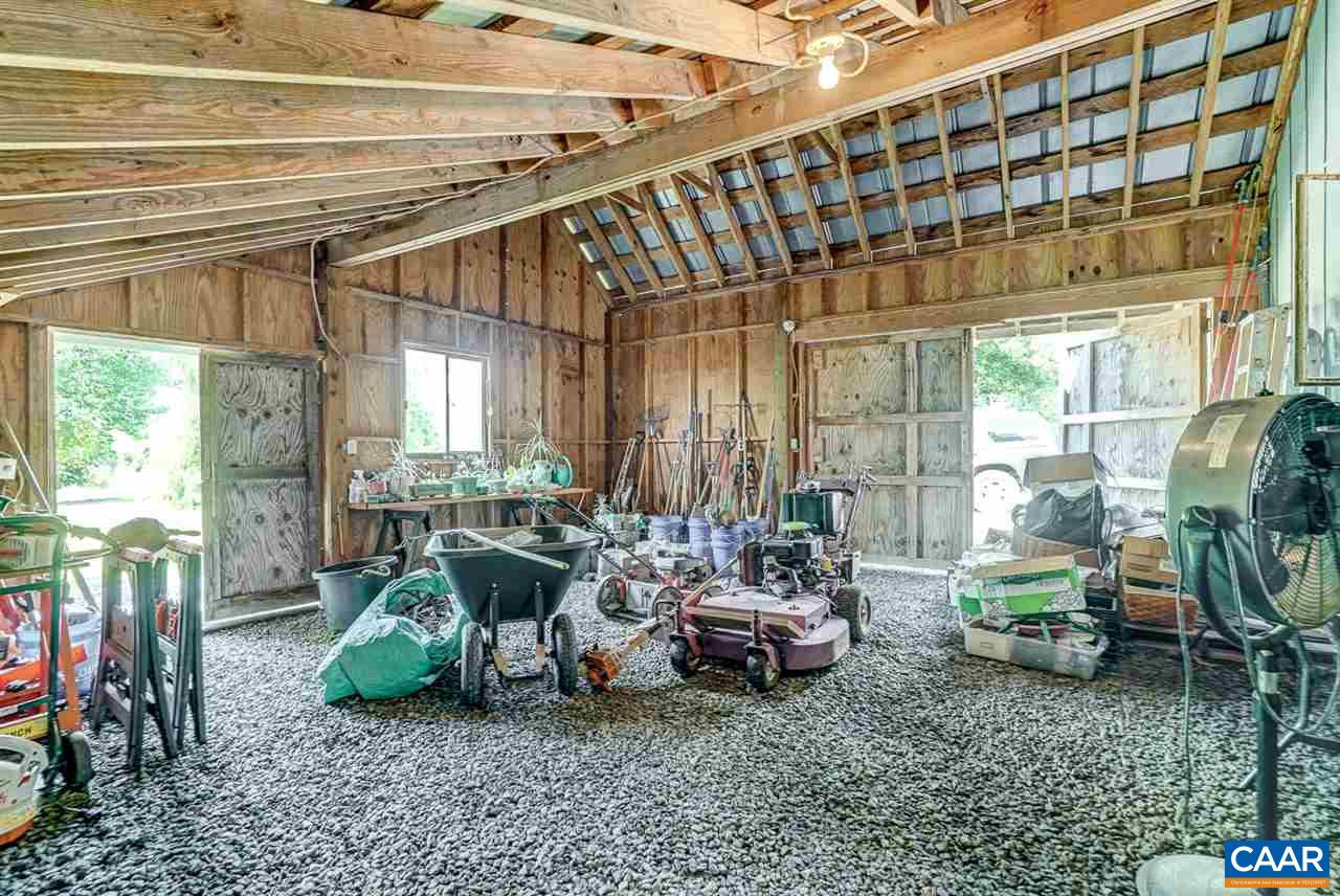2262 Hamilton Road Louisa, VA 23093 - Photo 27 of 49 a room with lots of furniture and a chandelier