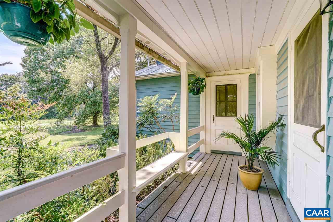 2262 Hamilton Road Louisa, VA 23093 - Photo 29 of 49 a view of balcony with chair and wooden floor