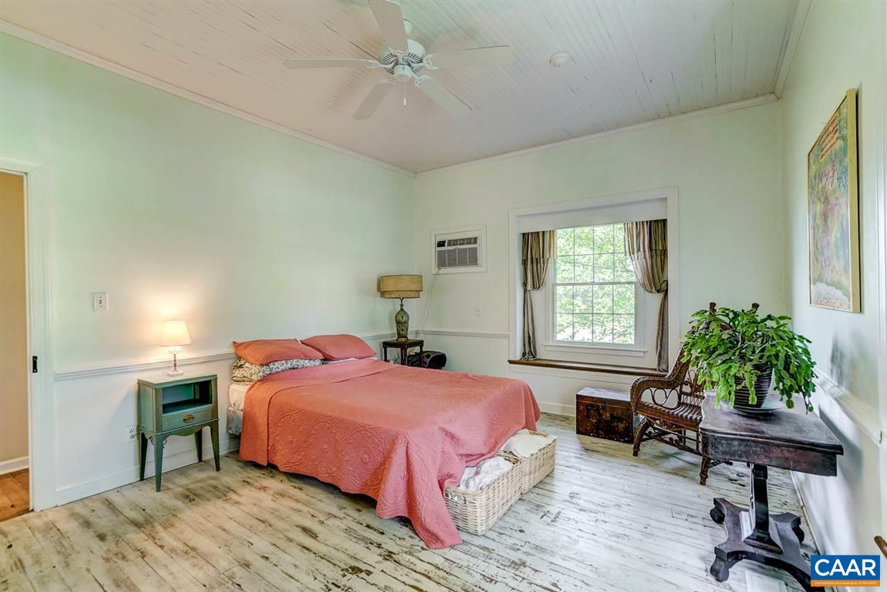 2262 Hamilton Road Louisa, VA 23093 - Photo 7 of 49 a bedroom with a bed table chair and a window