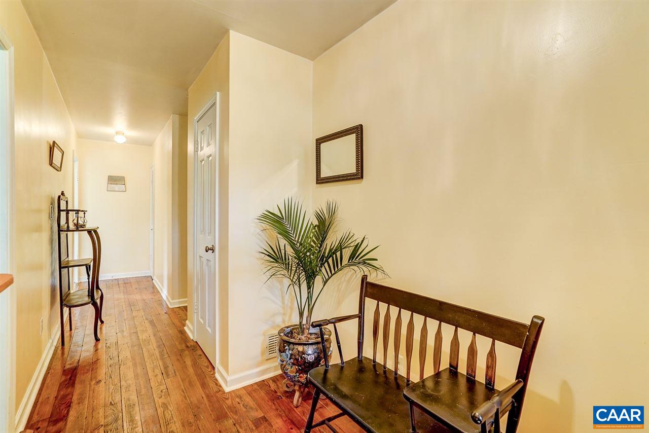 2262 Hamilton Road Louisa, VA 23093 - Photo 10 of 49 a view of a hallway with furniture and wooden floor