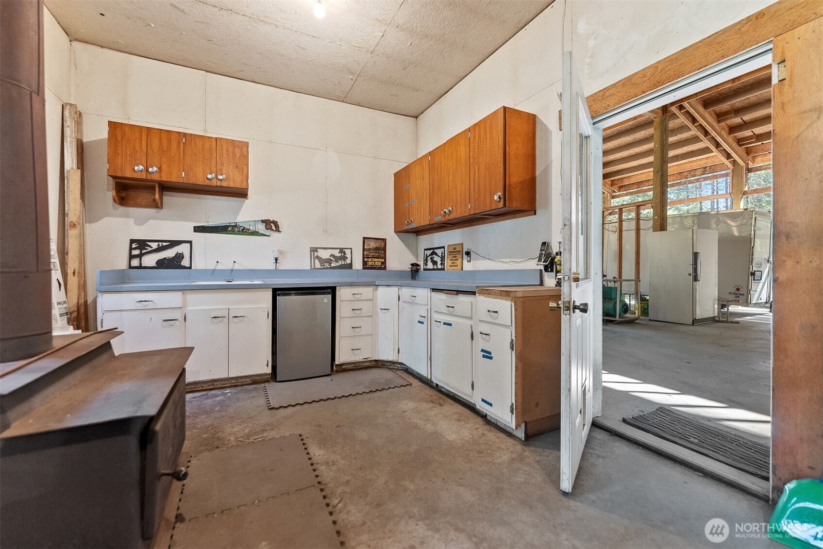 583 B Twisp River Road Twisp, WA 98856 - Photo 35 of 39 a kitchen with a sink stove and cabinets