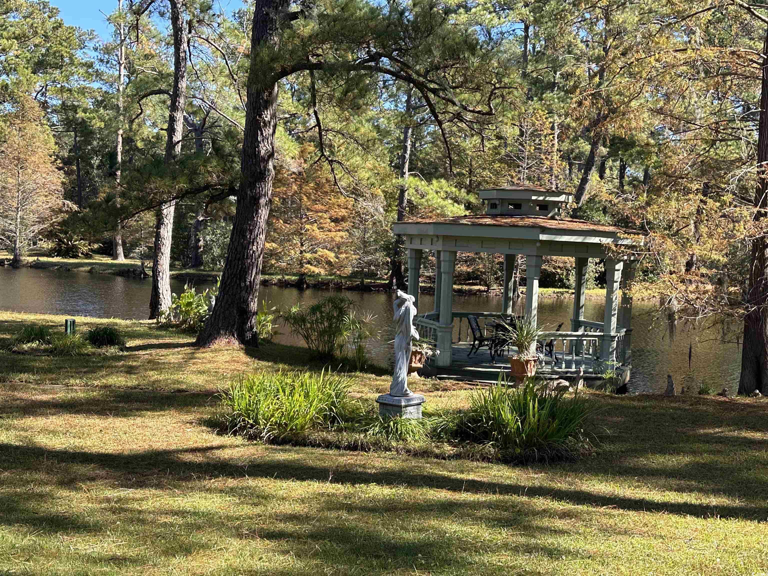 2840 Pennyroyal Road Georgetown, SC 29440 - Photo 16 of 36 Dock featuring a gazebo, a yard, a water view, and a patio