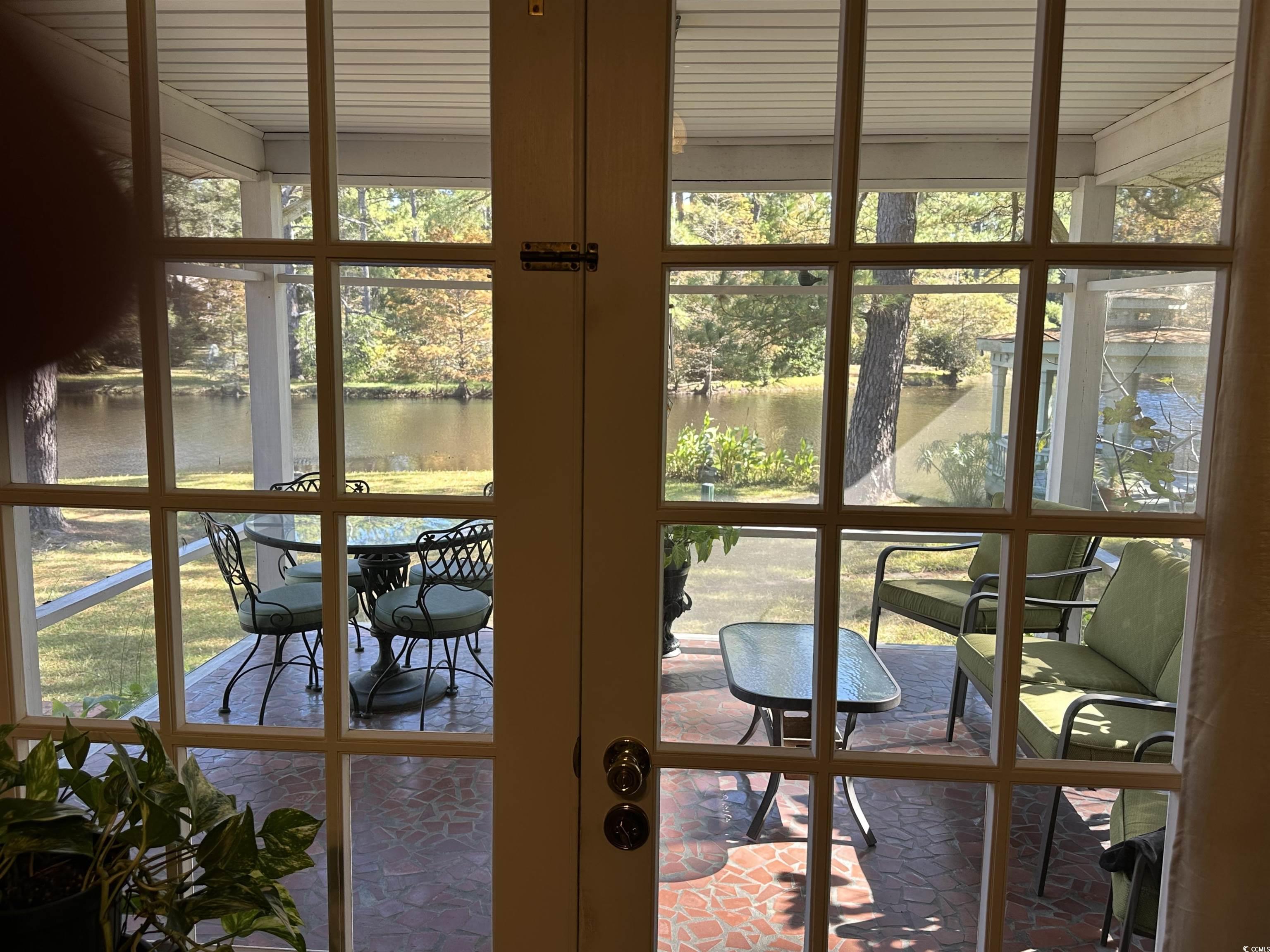 2840 Pennyroyal Road Georgetown, SC 29440 - Photo 25 of 36 Screen porch / solarium with plenty of natural light and a water view