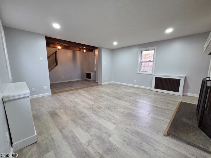 97 Fairmount Road West Califon, NJ 07830 - Photo 18 of 41 a view of empty room with wooden floor and fan