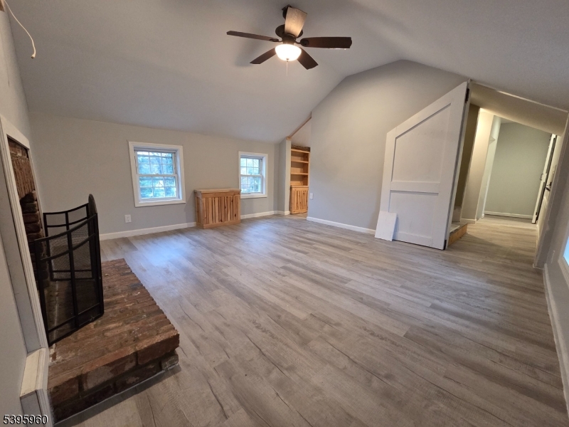 97 Fairmount Road West Califon, NJ 07830 - Photo 23 of 41 a view of a livingroom with wooden floor and a ceiling fan