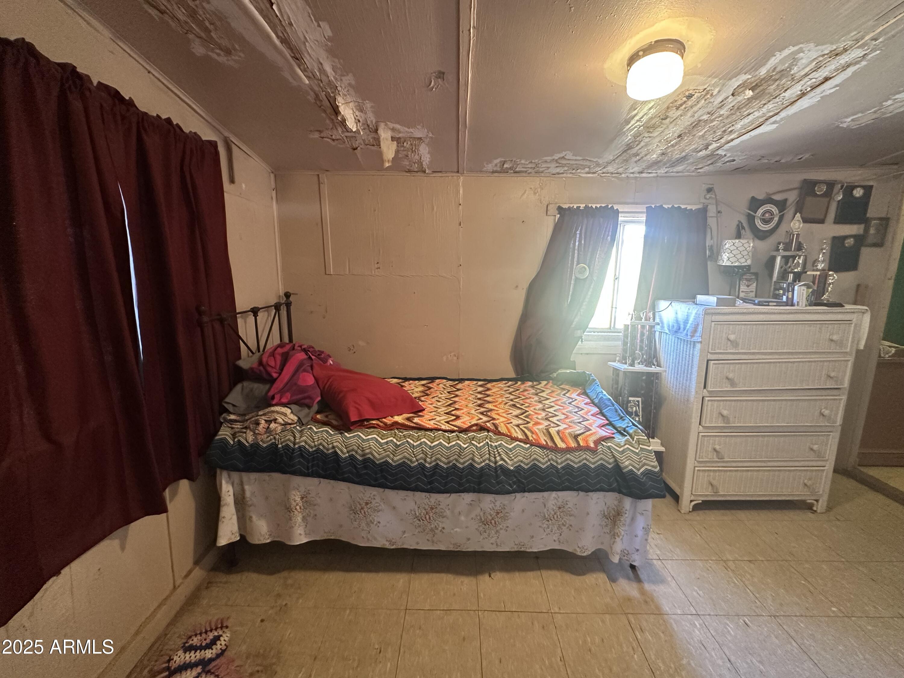 505 North D Street Eloy, AZ 85131 - Photo 11 of 25 a bedroom with a bed and a dresser