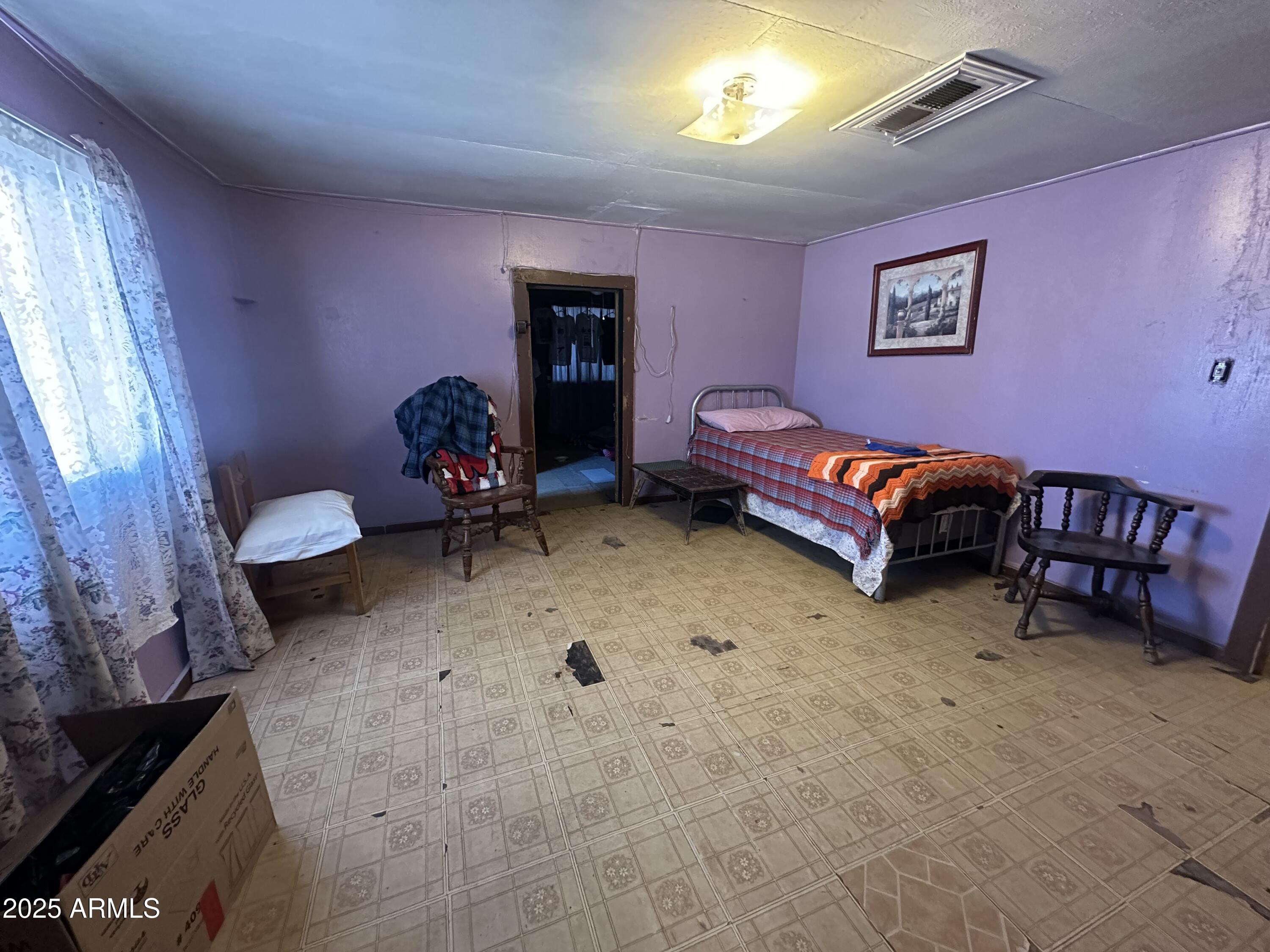 505 North D Street Eloy, AZ 85131 - Photo 16 of 25 a living room with furniture and a window