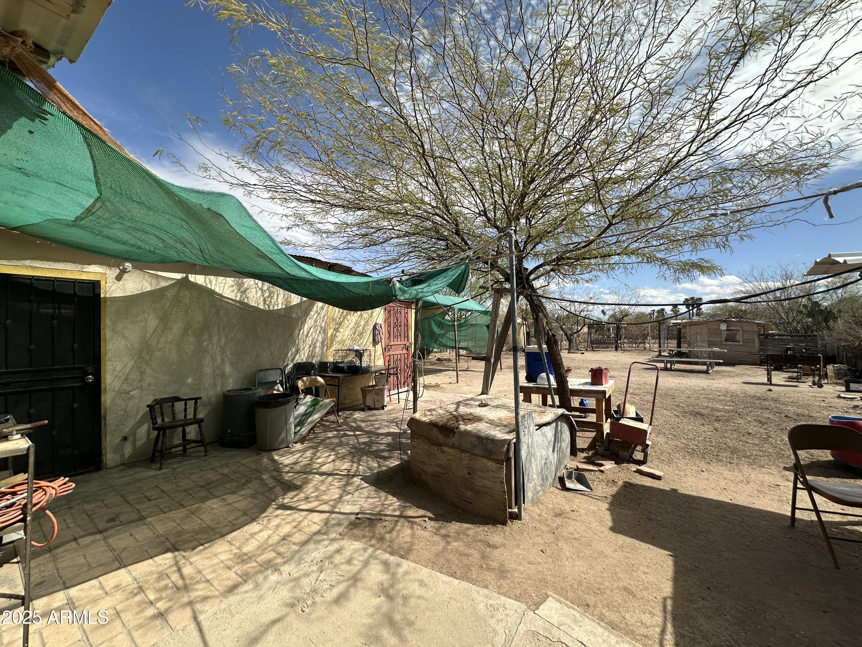 505 North D Street Eloy, AZ 85131 - Photo 21 of 25 a view of a patio with table and chairs under an umbrella