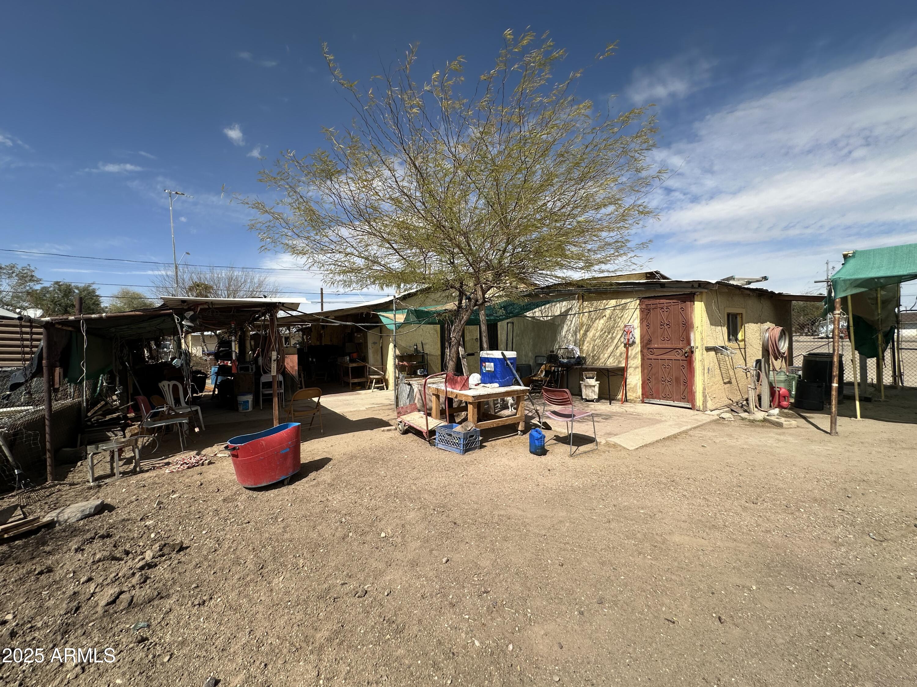 505 North D Street Eloy, AZ 85131 - Photo 23 of 25 a view of a patio with a table and chairs and a barbeque