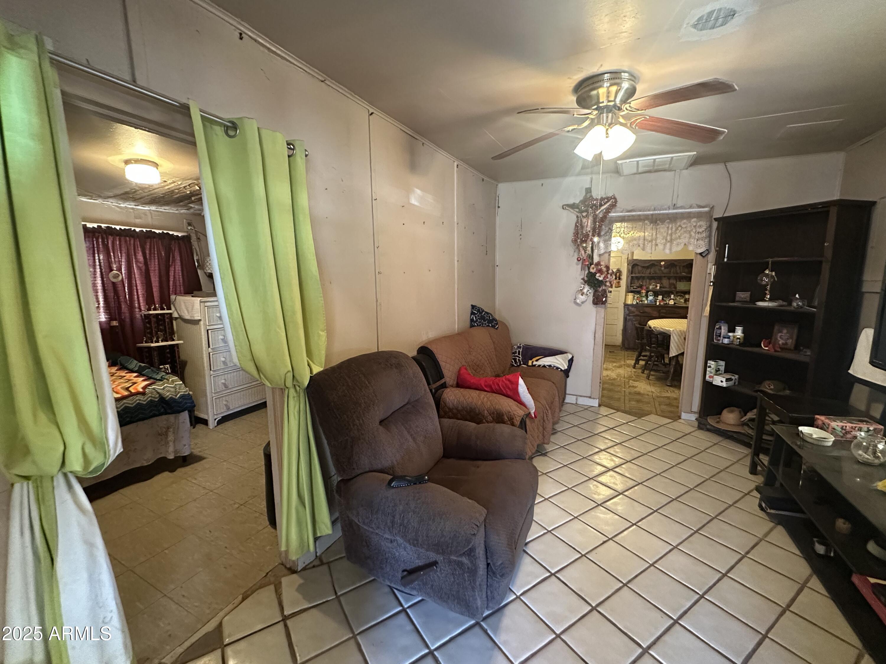 505 North D Street Eloy, AZ 85131 - Photo 6 of 25 a living room with furniture and a flat screen tv