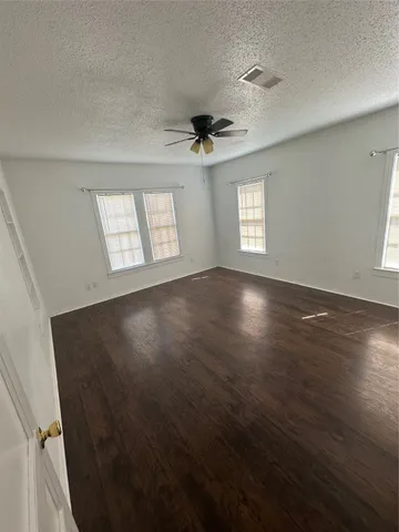 a house view with swimming pool in front of the house