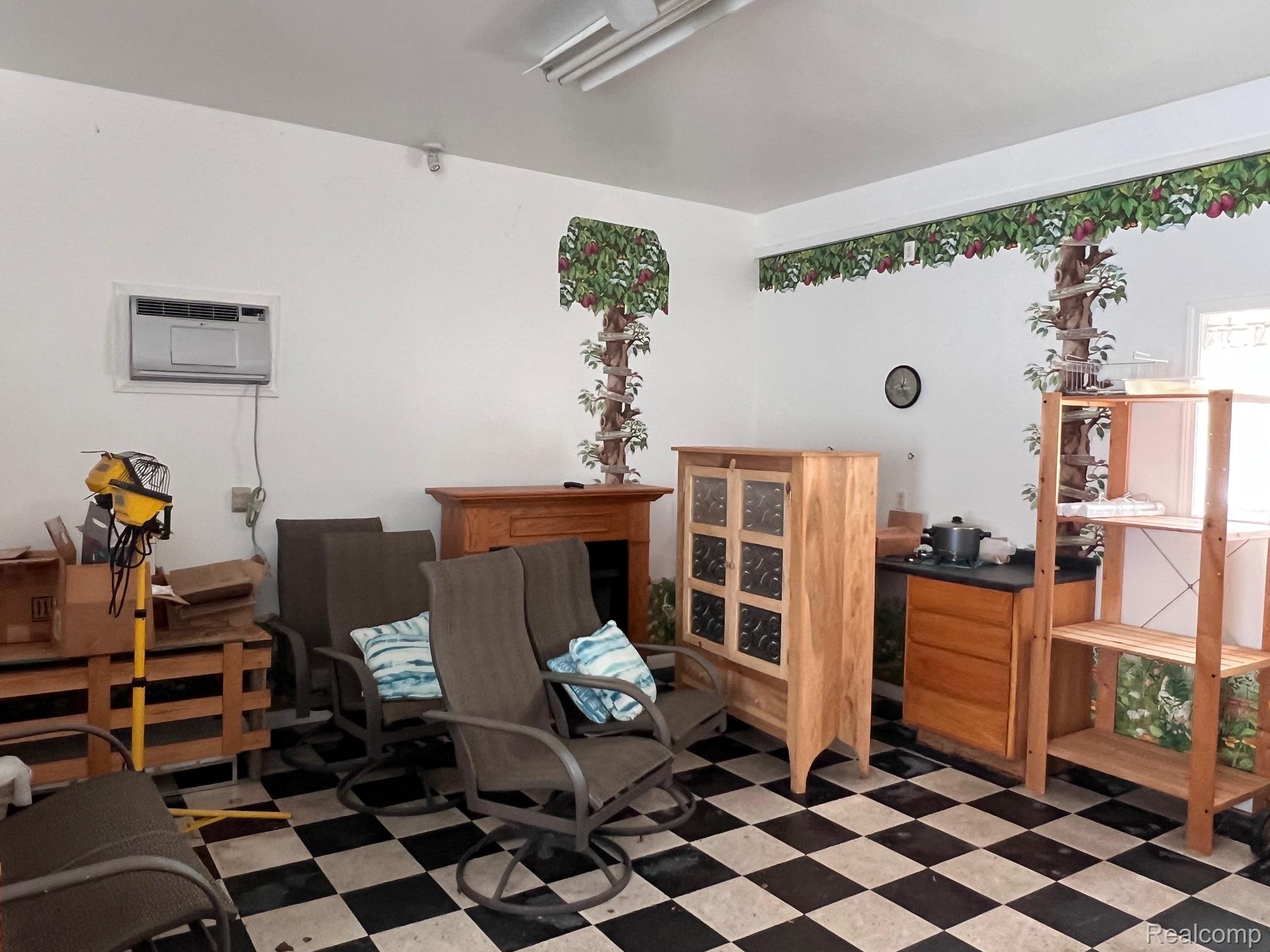 651 East Beard Road Perry, MI 48872 - Photo 26 of 29 Miscellaneous room featuring dark floors and a wall unit AC