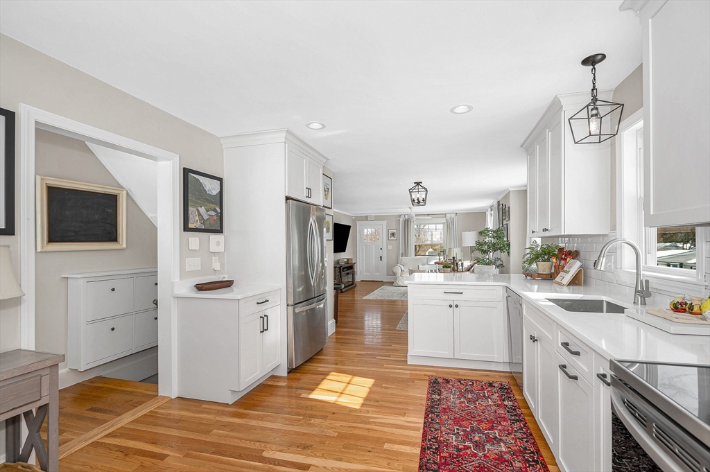 430 West Street Reading, MA 01867 - Photo 11 of 35 a kitchen with white cabinets and stainless steel appliances