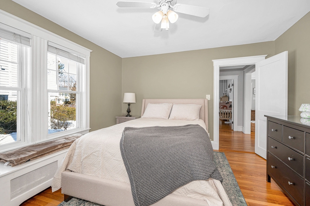 430 West Street Reading, MA 01867 - Photo 15 of 35 a bedroom with a bed and a large window