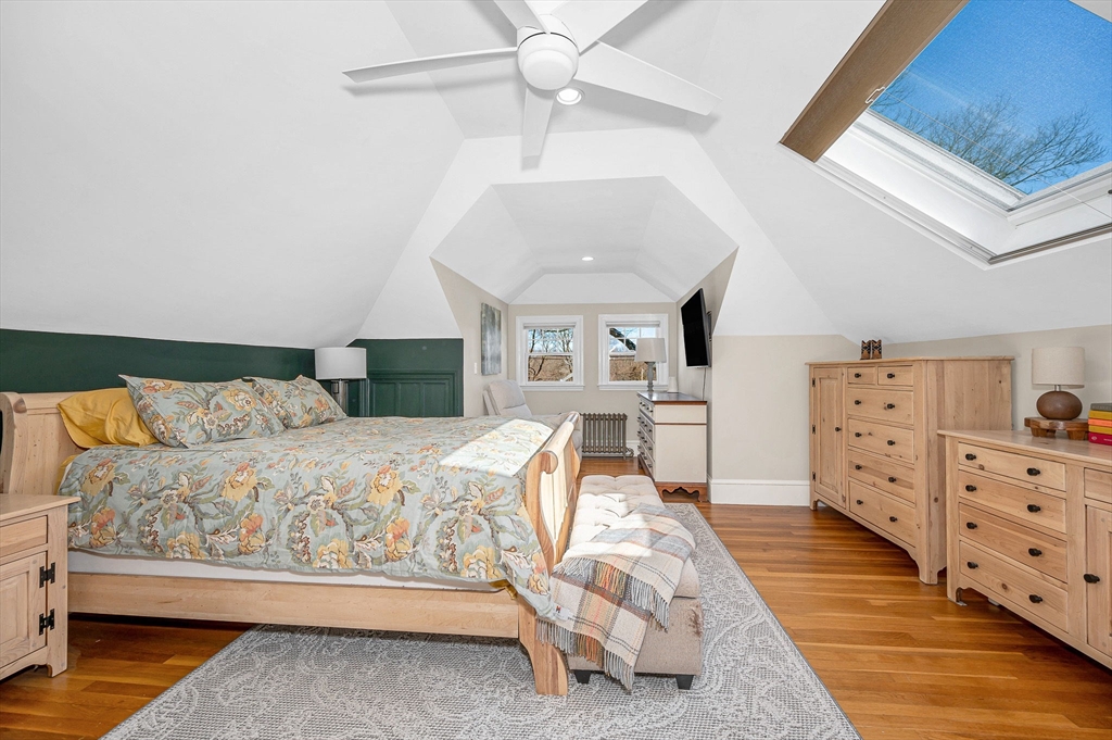 430 West Street Reading, MA 01867 - Photo 17 of 35 a bedroom with a large bed and ceiling fan