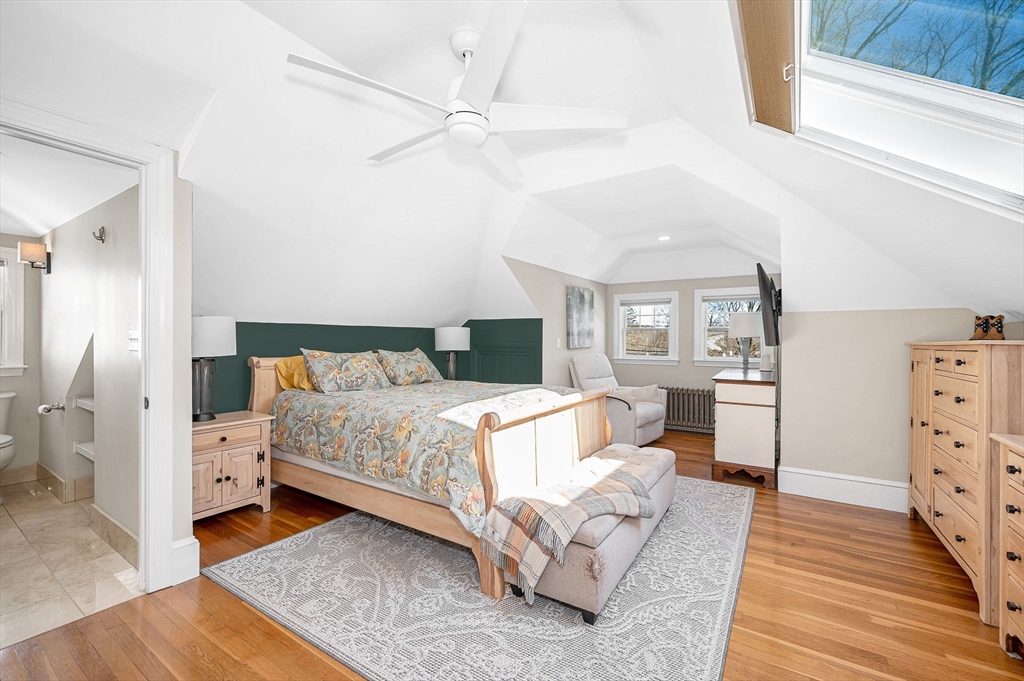 430 West Street Reading, MA 01867 - Photo 18 of 35 a bedroom with a bed and a wooden floor
