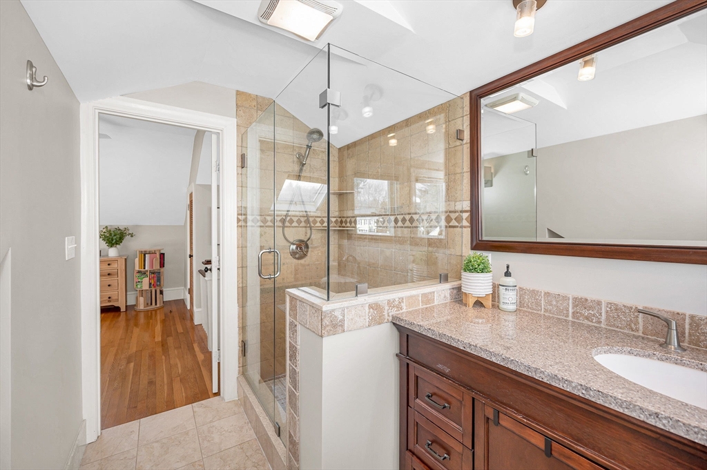 430 West Street Reading, MA 01867 - Photo 23 of 35 a spacious bathroom with a granite countertop sink mirror and double