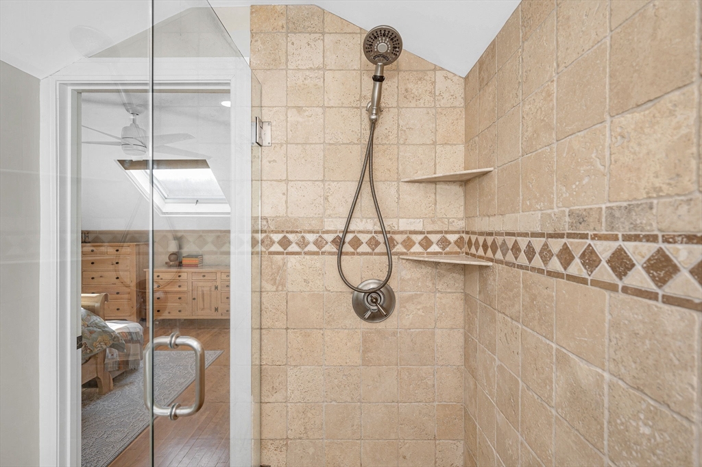 430 West Street Reading, MA 01867 - Photo 24 of 35 a bathroom with a glass shower door