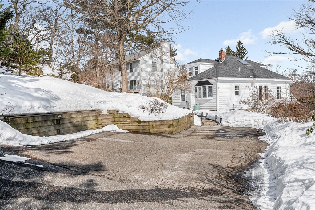 430 West Street Reading, MA 01867 - Photo 27 of 35 a view of a house with snow on the background