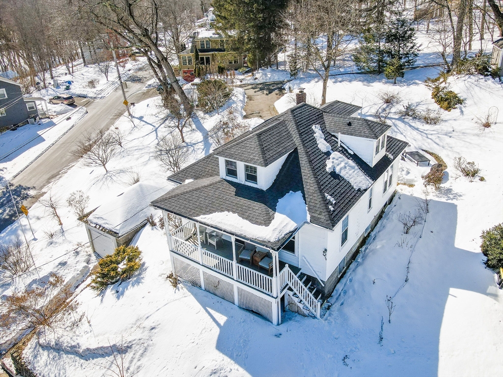 430 West Street Reading, MA 01867 - Photo 28 of 35 a view of a house with a yard covered in snow