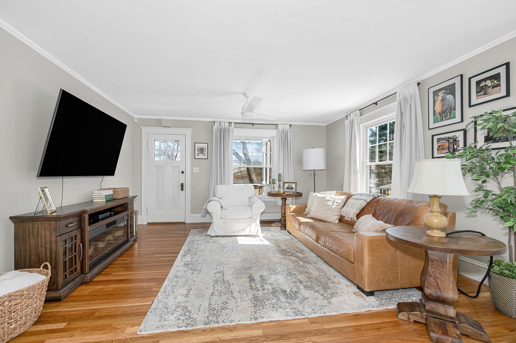 430 West Street Reading, MA 01867 - Photo 3 of 35 a living room with furniture and a flat screen tv