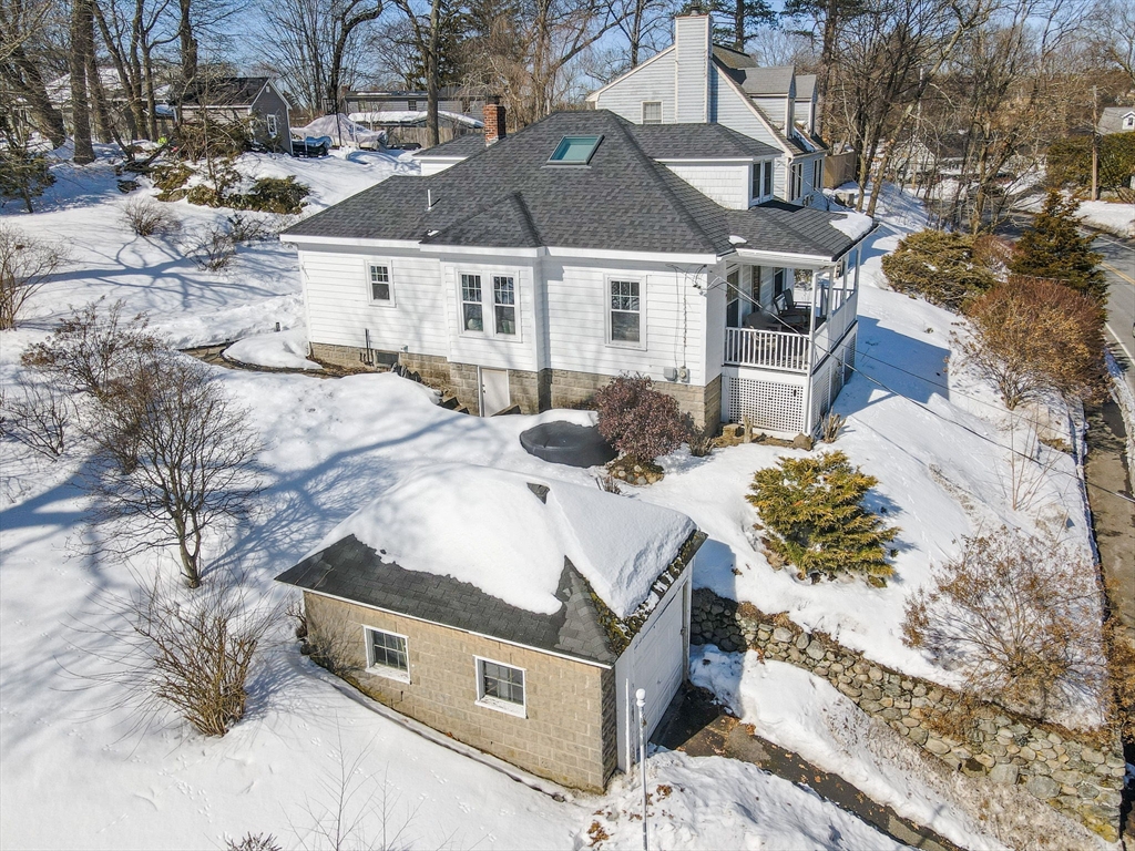 430 West Street Reading, MA 01867 - Photo 31 of 35 a front view of a house with a yard