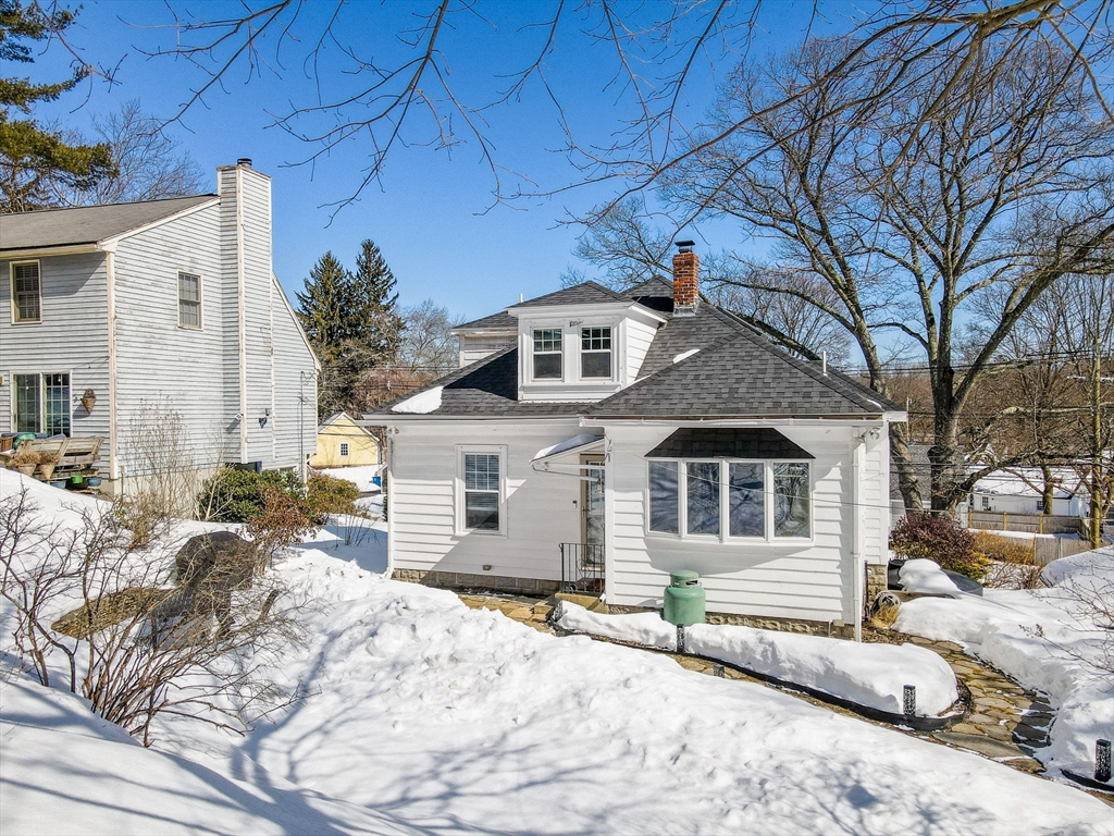 430 West Street Reading, MA 01867 - Photo 32 of 35 a front view of a house with a yard
