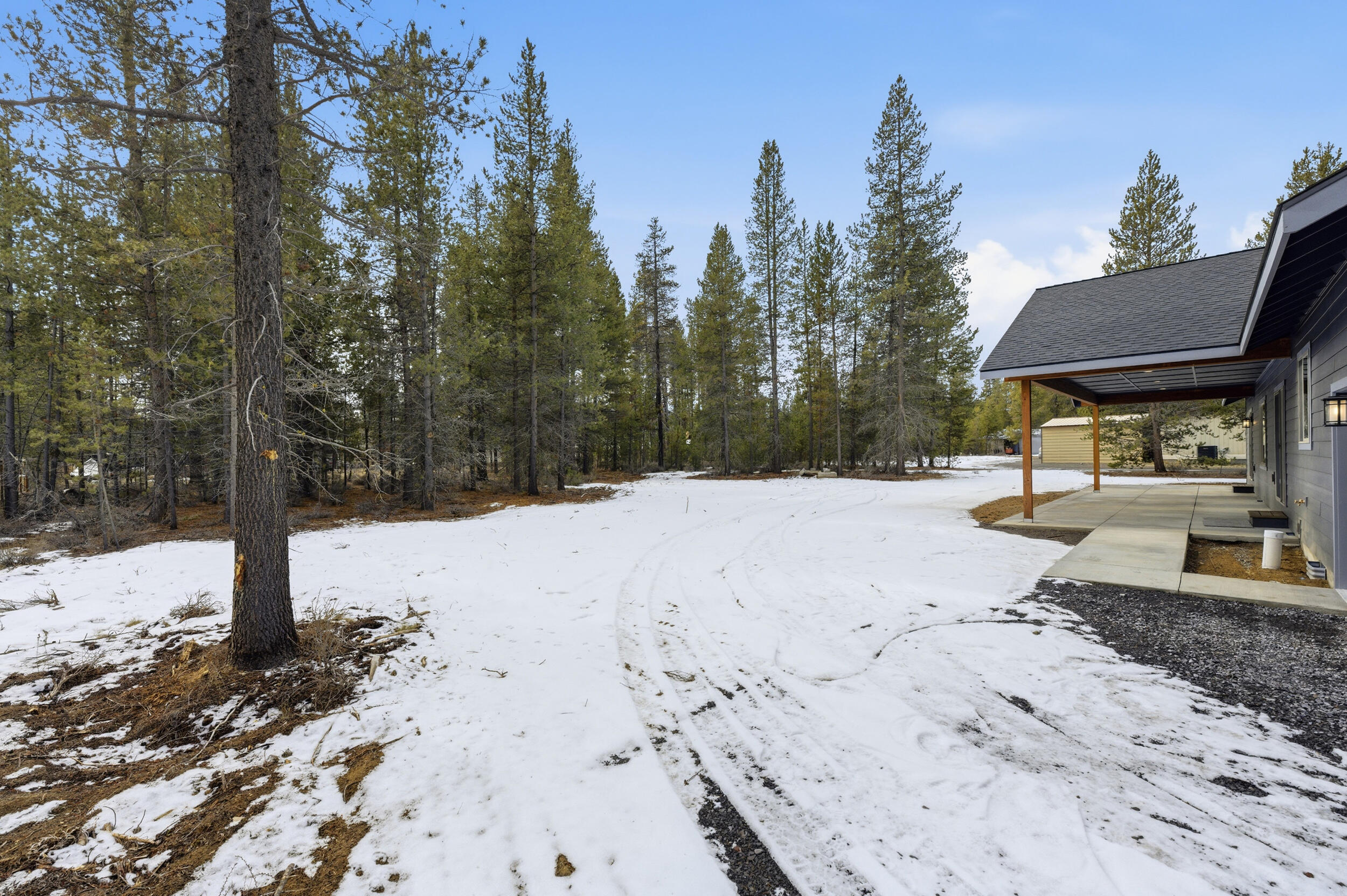 16083 Dyke Road, Unit 9 La Pine, OR 97739 - Photo 45 of 53 a view of a road with snow on the road